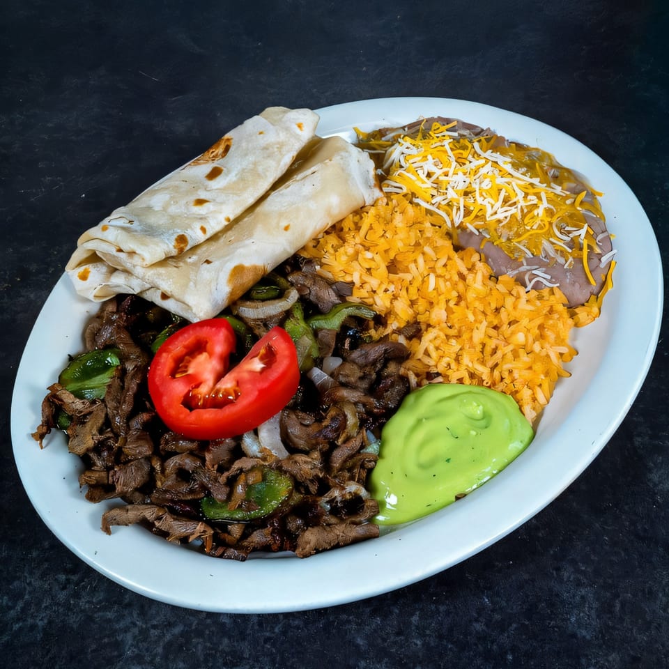 A Highlands D'Leon's Mexican dish with steak, rice, beans, tortillas, and guacamole.
